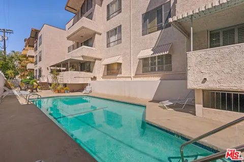 a aerial view of a house with a yard