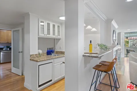 a view of kitchen with cabinets and wooden floor