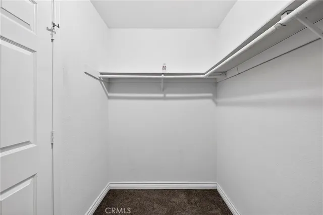 a view of storage and utility room with racks on the wall