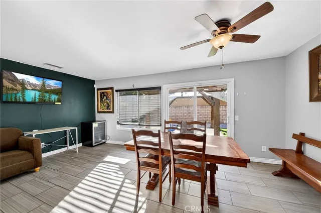 a dining room with furniture and window