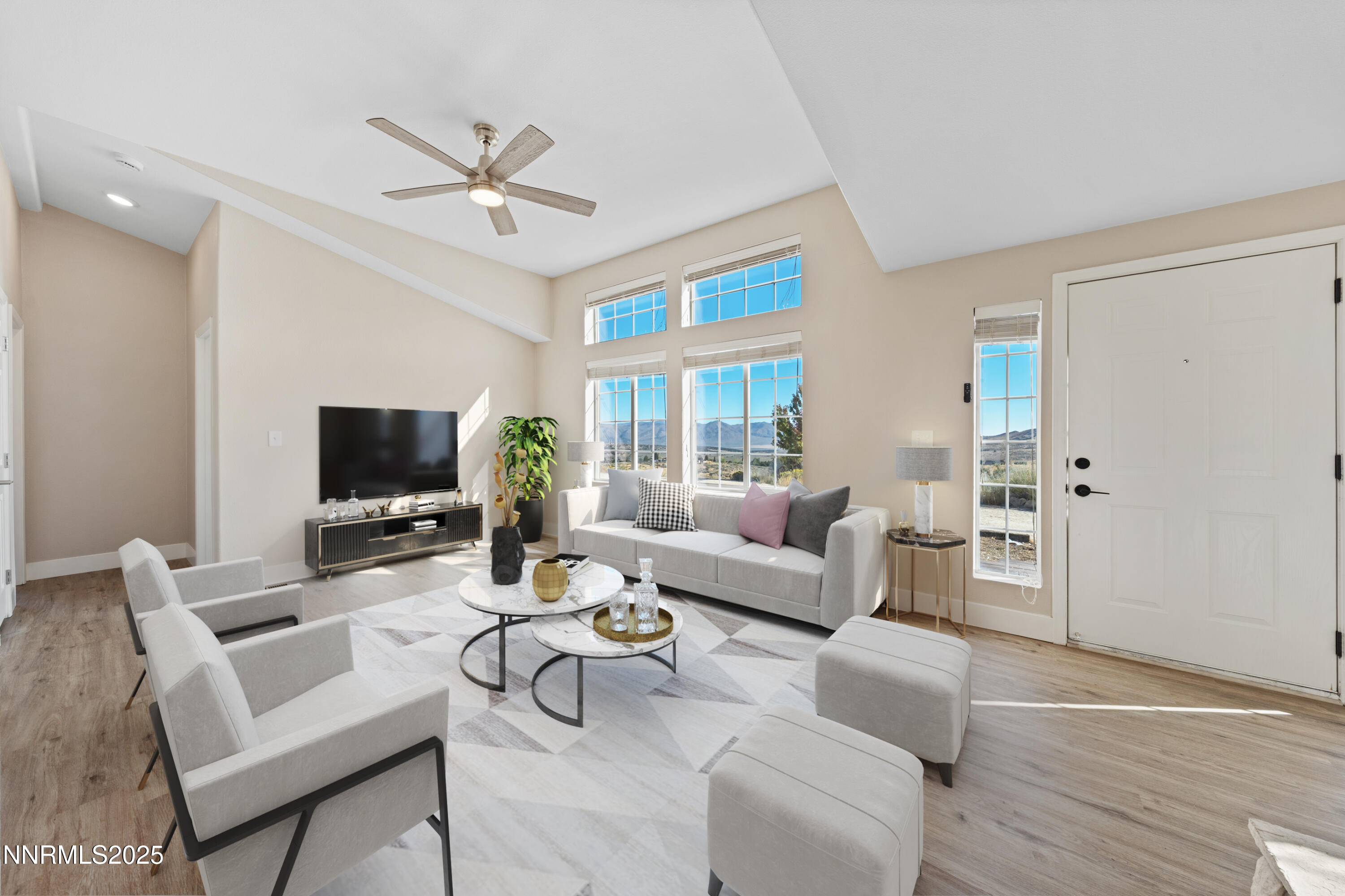 15190 North Red Rock Road Reno, NV 89508 - Photo 15 of 55 a living room with furniture a ceiling fan and a flat screen tv