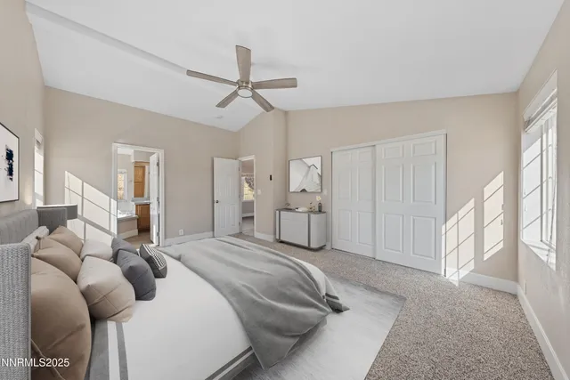 a bathroom with a granite countertop toilet sink and mirror