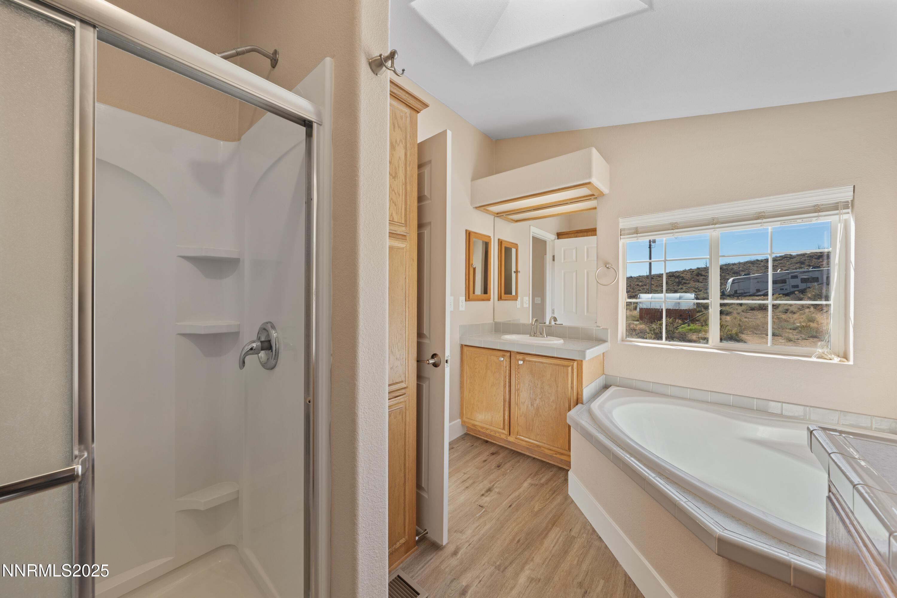 15190 North Red Rock Road Reno, NV 89508 - Photo 36 of 55 a bathroom with a granite countertop tub shower and sink