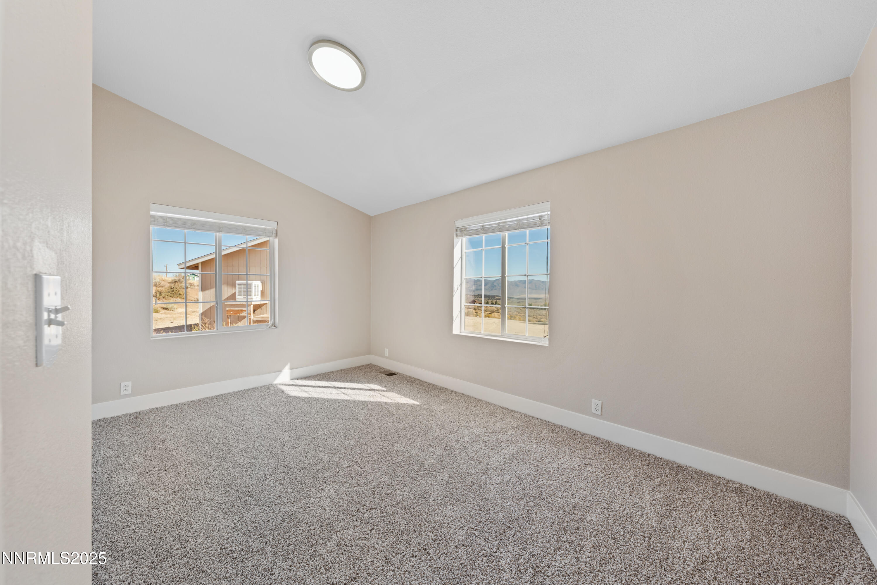 15190 North Red Rock Road Reno, NV 89508 - Photo 39 of 55 an empty room with windows