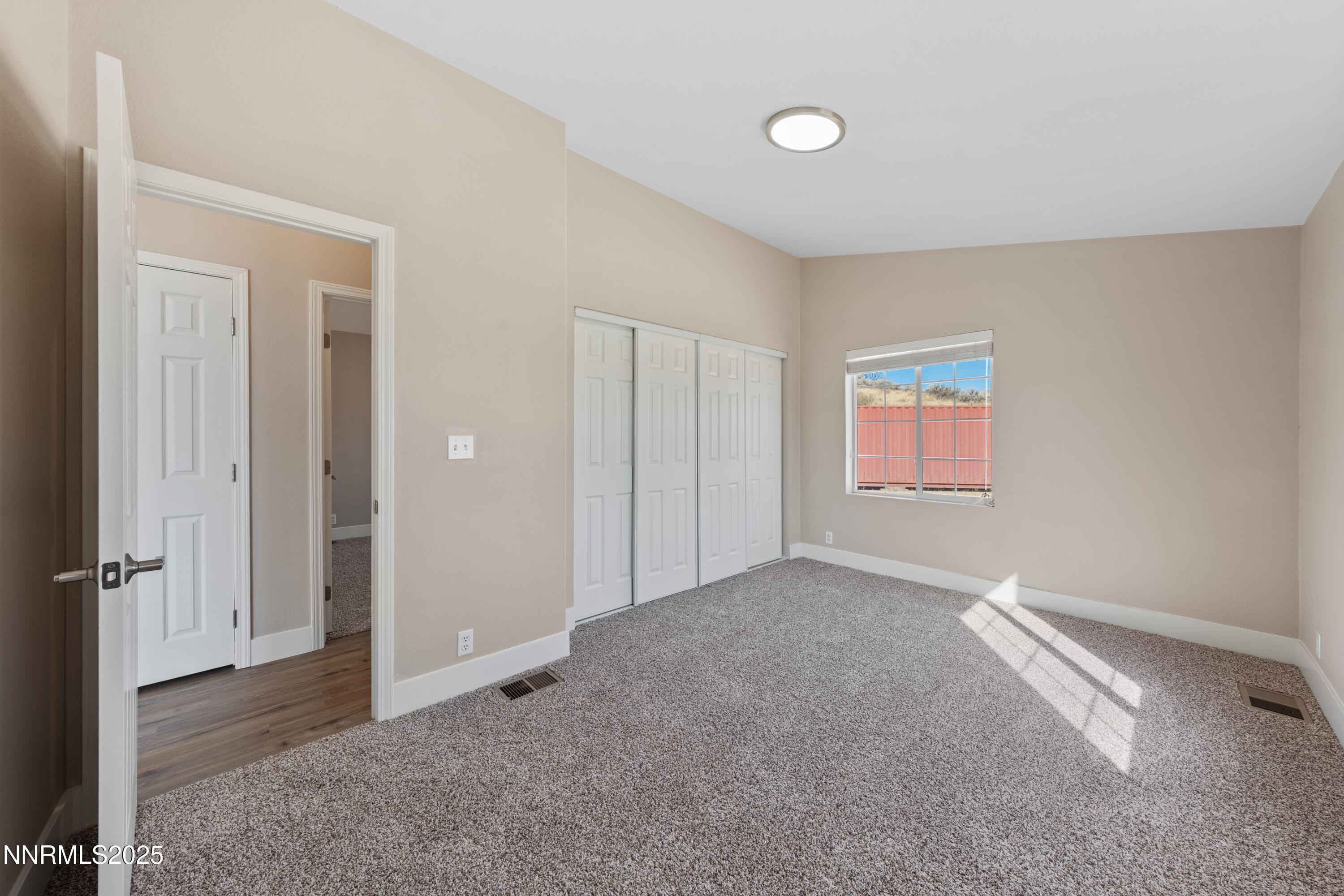 15190 North Red Rock Road Reno, NV 89508 - Photo 41 of 55 an empty room with windows and closet