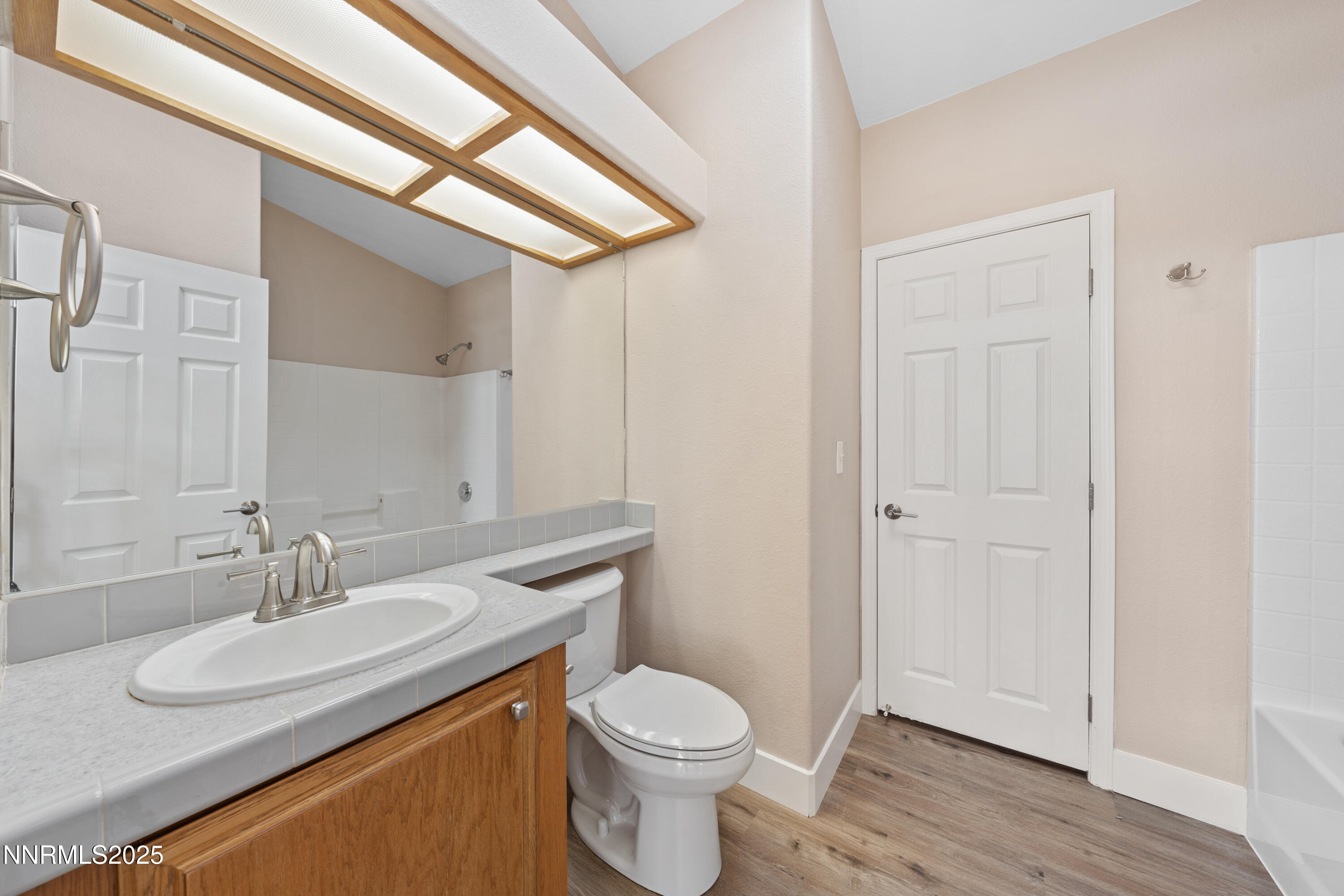 15190 North Red Rock Road Reno, NV 89508 - Photo 45 of 55 a bathroom with a granite countertop toilet sink and mirror