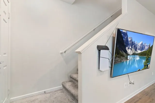 a bathroom with a toilet and a shower curtain