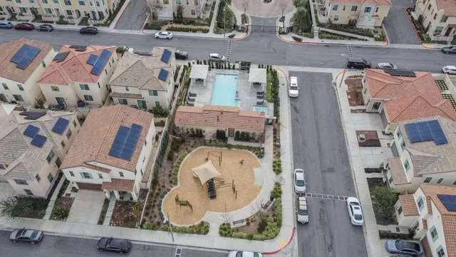 an aerial view of a house with a garden and entryway