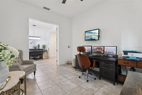 a spacious bathroom with a tub sink and mirror