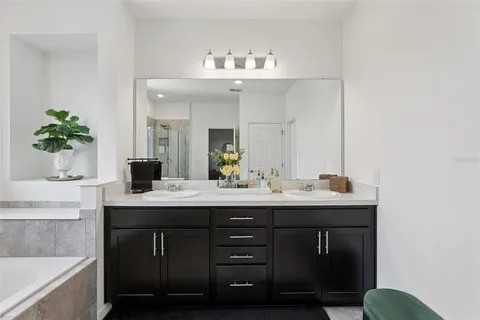 a bedroom that has a bed and a chair in it