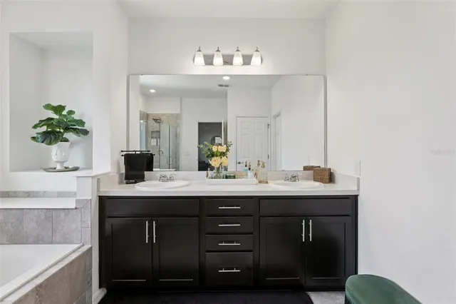 a bedroom that has a bed and a chair in it