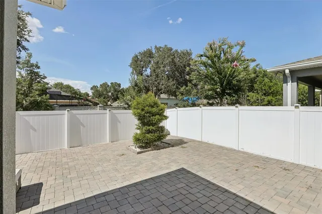 an aerial view of a house with yard swimming pool and outdoor seating