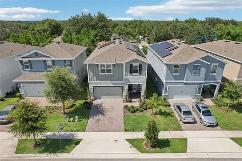 an aerial view of a house with a garden