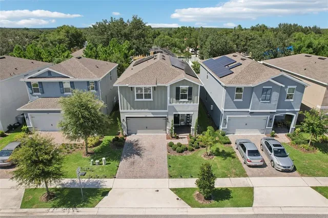 an aerial view of a house with a garden