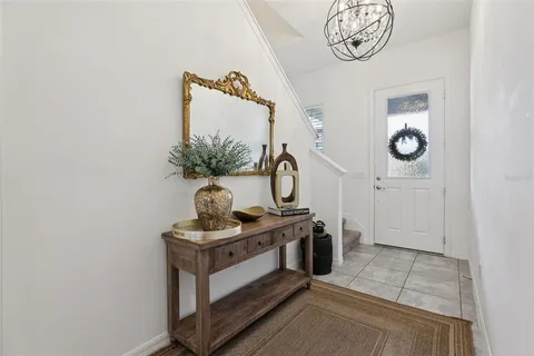 a living room with furniture and white walls