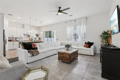 a kitchen with kitchen island granite countertop a sink a center island and appliances