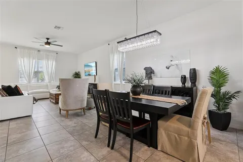 a kitchen with a center island appliances and cabinets