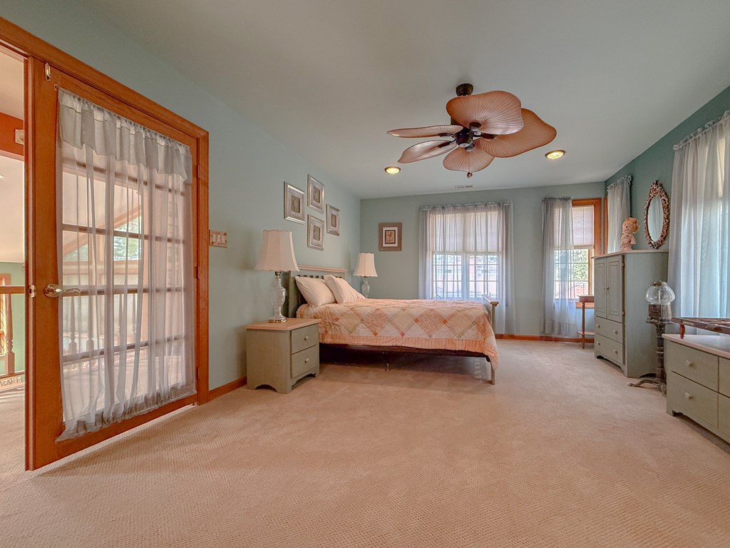 13581 Solitude Trail Machipongo, VA 23405 - Photo 21 of 51 a bedroom with bed and window