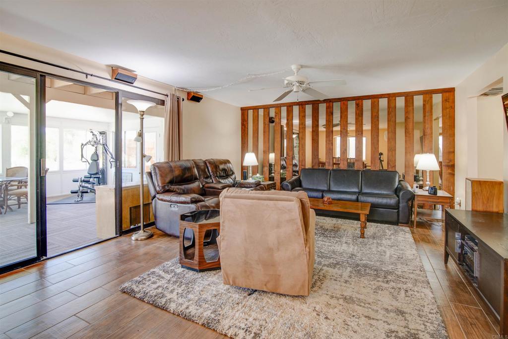 3456 El Tejon Road Borrego Springs, CA 92004 - Photo 4 of 17 a living room with furniture a large window and wooden floor