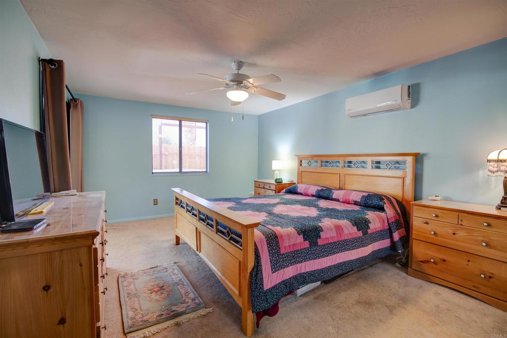 3456 El Tejon Road Borrego Springs, CA 92004 - Photo 8 of 17 a bedroom with a bed and a dresser in it