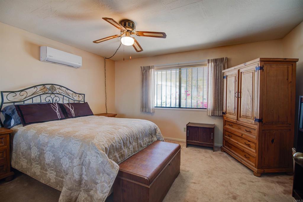 3456 El Tejon Road Borrego Springs, CA 92004 - Photo 10 of 17 a bedroom with a bed lamps and dresser