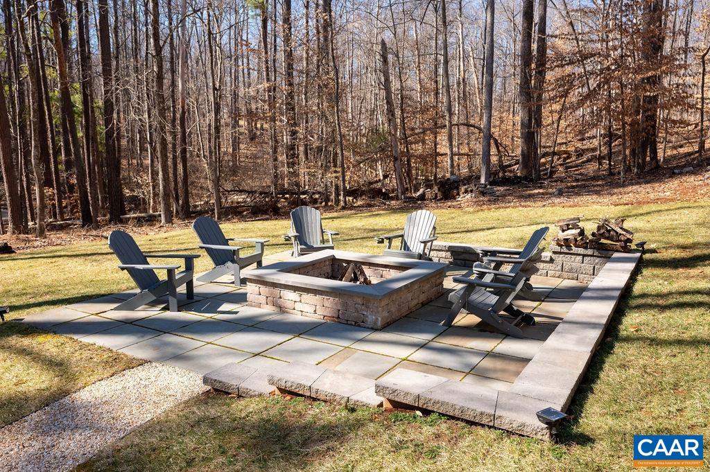 1205 Hunters Ridge Road Earlysville, VA 22936 - Photo 28 of 35 a view of swimming pool with outdoor seating and trees