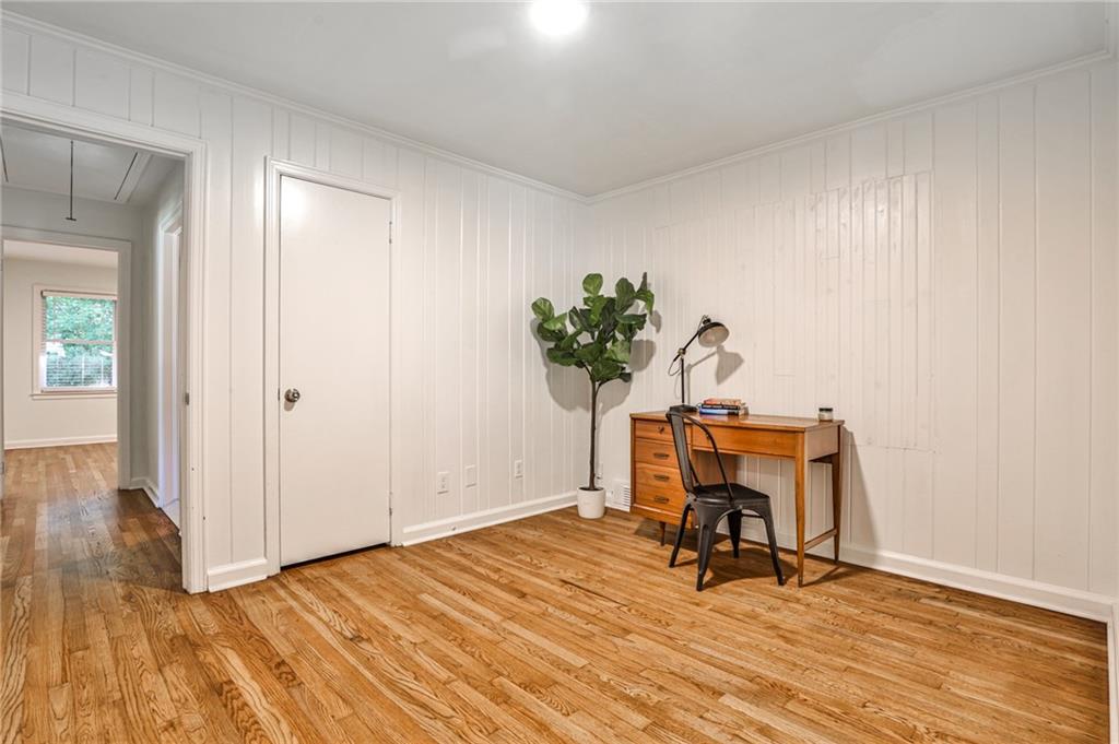 878 Scott Circle Decatur, GA 30033 - Photo 11 of 30 a view of a workspace with furniture and a potted plant