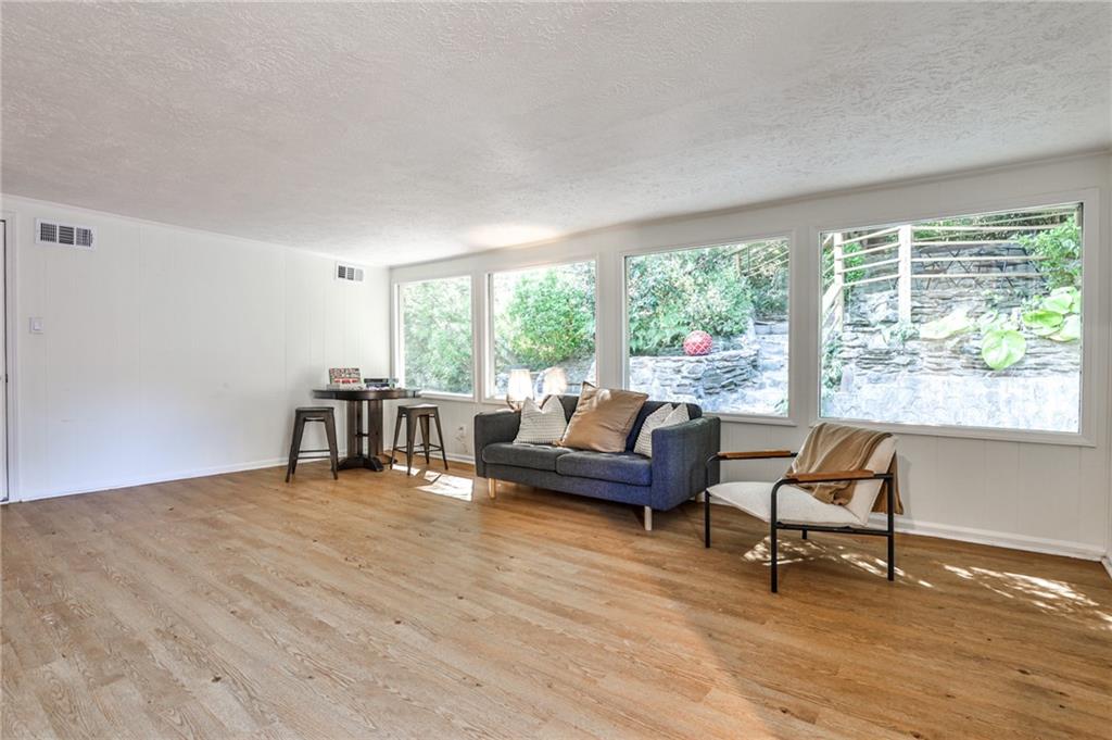 878 Scott Circle Decatur, GA 30033 - Photo 16 of 30 a living room with furniture and a wooden floor
