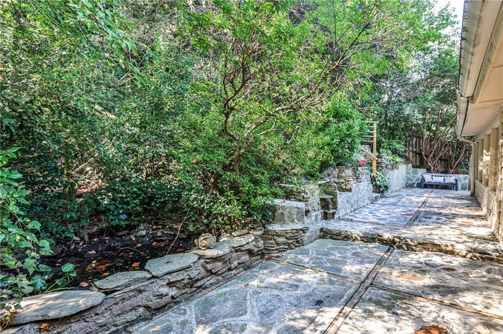 878 Scott Circle Decatur, GA 30033 - Photo 23 of 30 a view of a yard with plants and trees