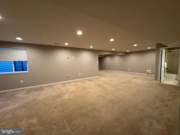 a view of an empty room with stairs