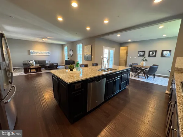 a kitchen with a stove sink and a refrigerator