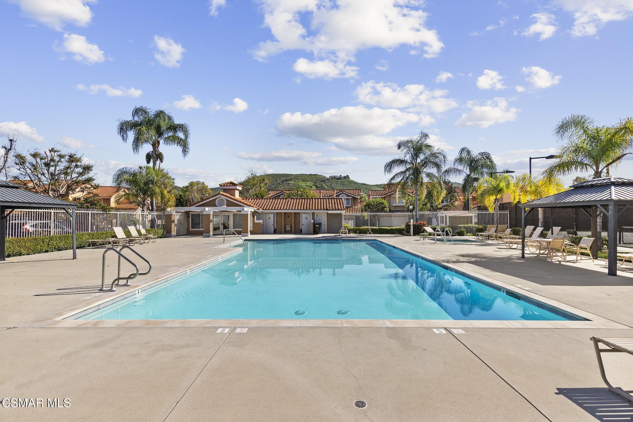 495 Novara Way Oak Park, CA 91377 - Photo 25 of 26 a view of a swimming pool with an outdoor seating