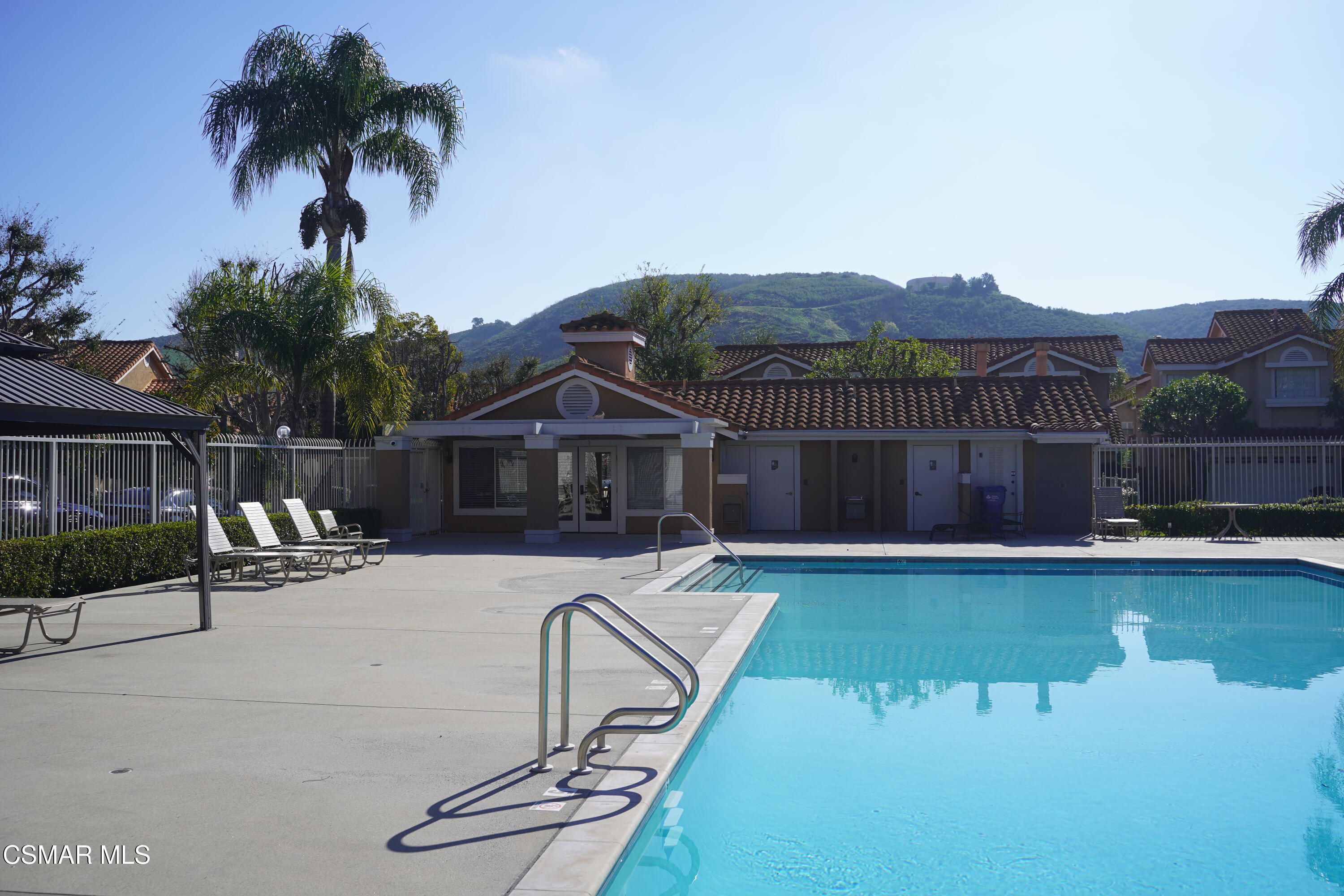 495 Novara Way Oak Park, CA 91377 - Photo 26 of 26 a front view of a house with swimming pool yard and outdoor seating