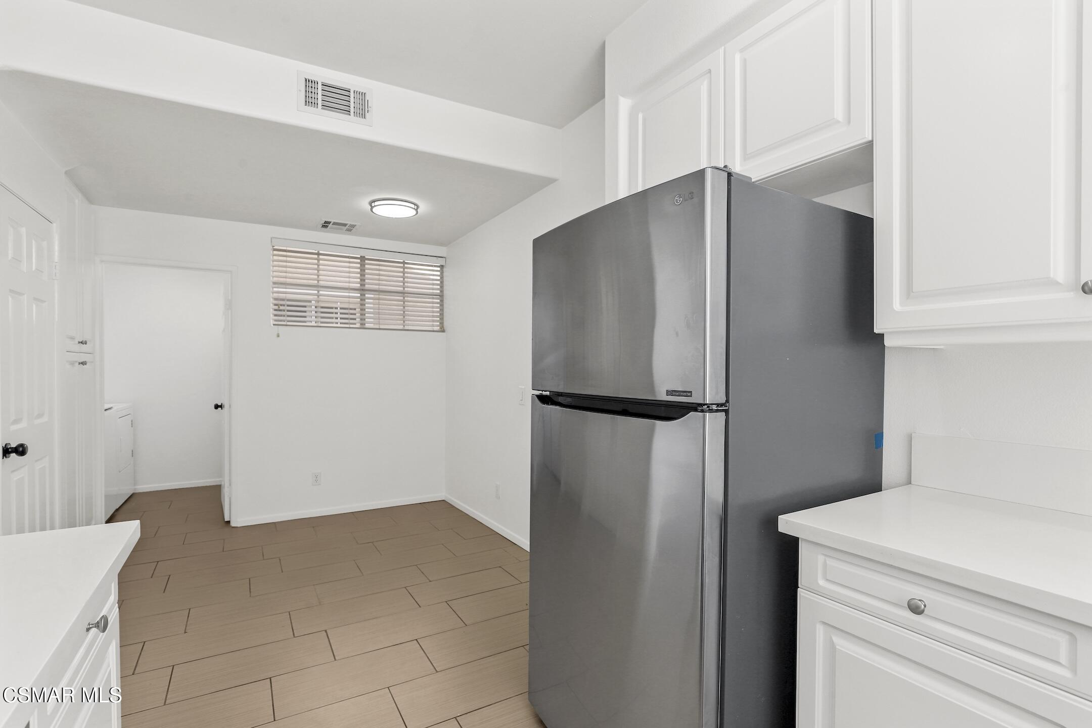495 Novara Way Oak Park, CA 91377 - Photo 8 of 26 Kitchen to laundry