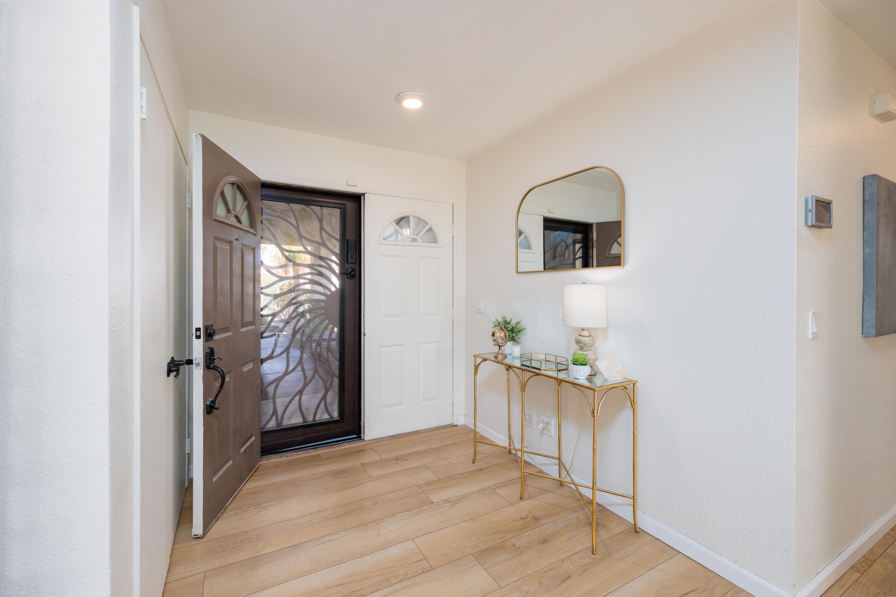 67395 Rango Road Cathedral City, CA 92234 - Photo 13 of 36 a view of a hallway to a livingroom with furniture