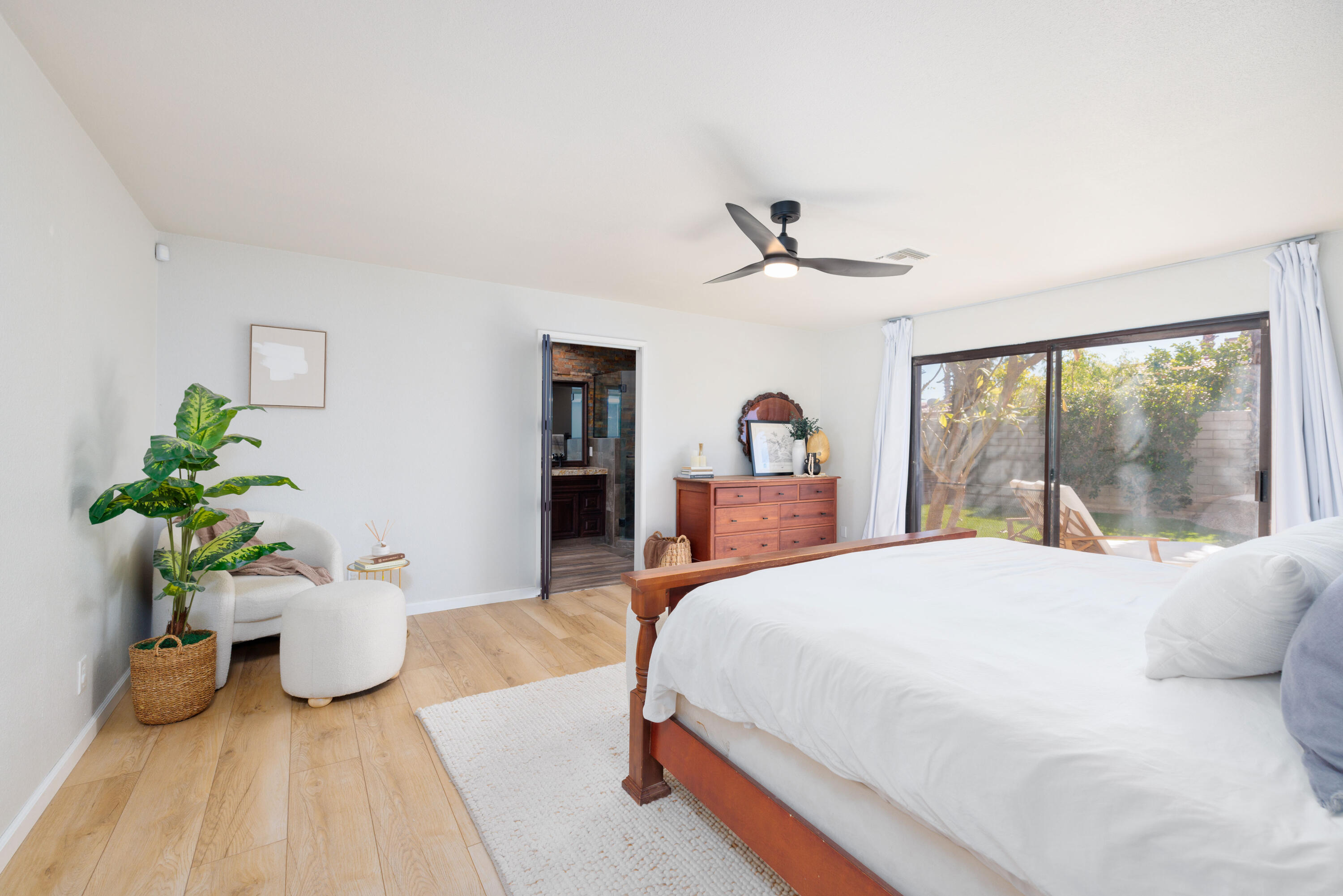67395 Rango Road Cathedral City, CA 92234 - Photo 14 of 36 a bedroom with a bed and a large window