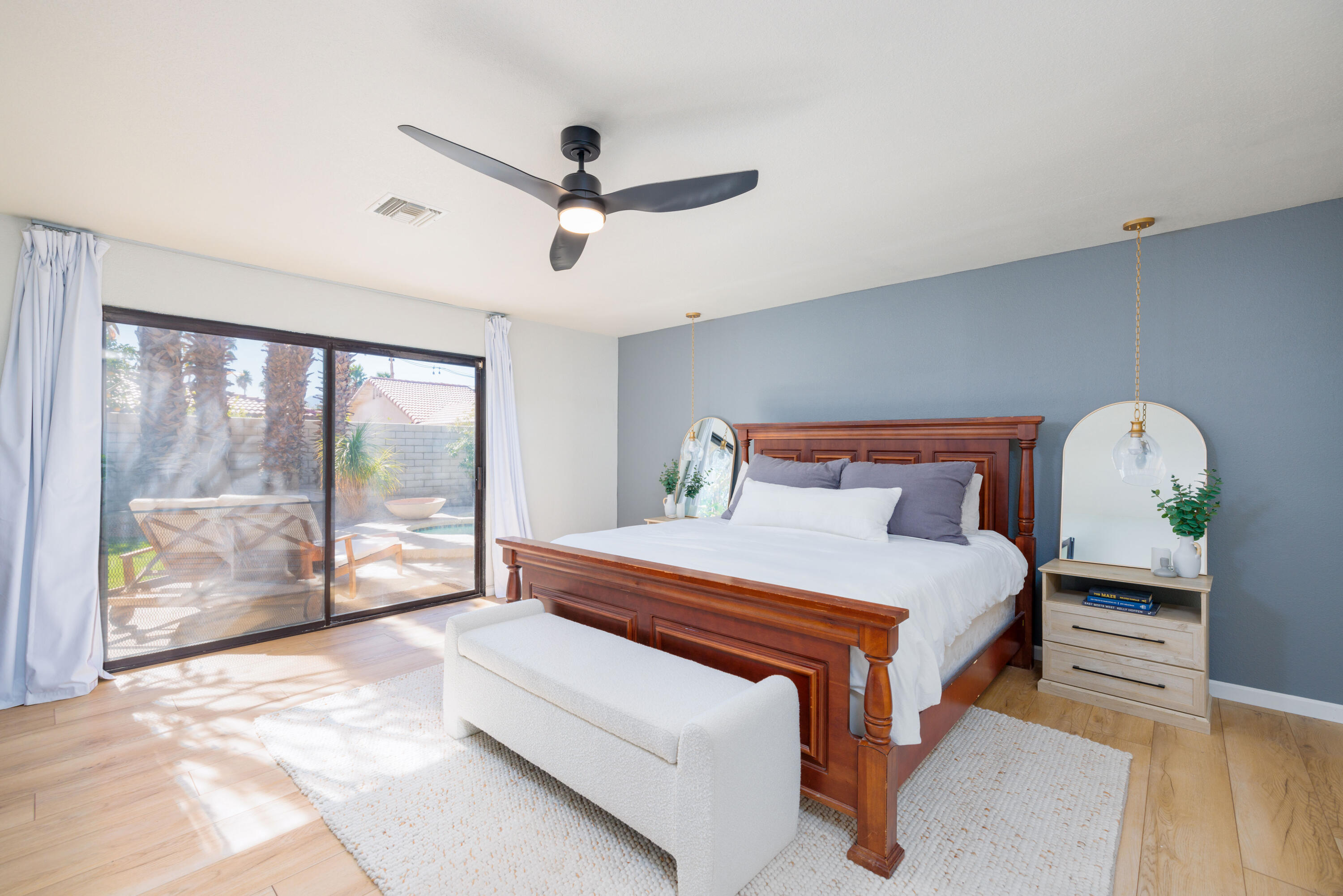 67395 Rango Road Cathedral City, CA 92234 - Photo 15 of 36 a bedroom with a bed and a large window