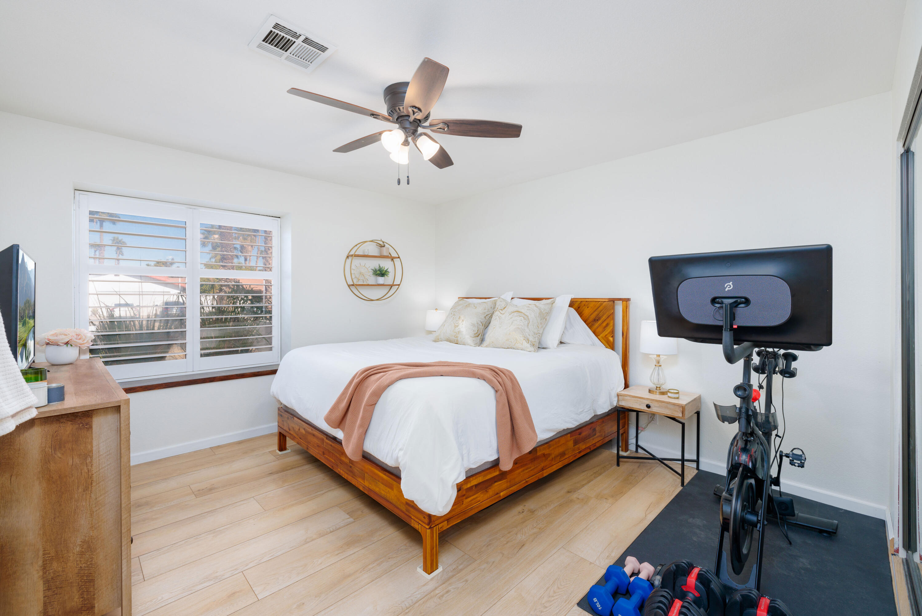 67395 Rango Road Cathedral City, CA 92234 - Photo 19 of 36 a bedroom with a bed and wooden floor