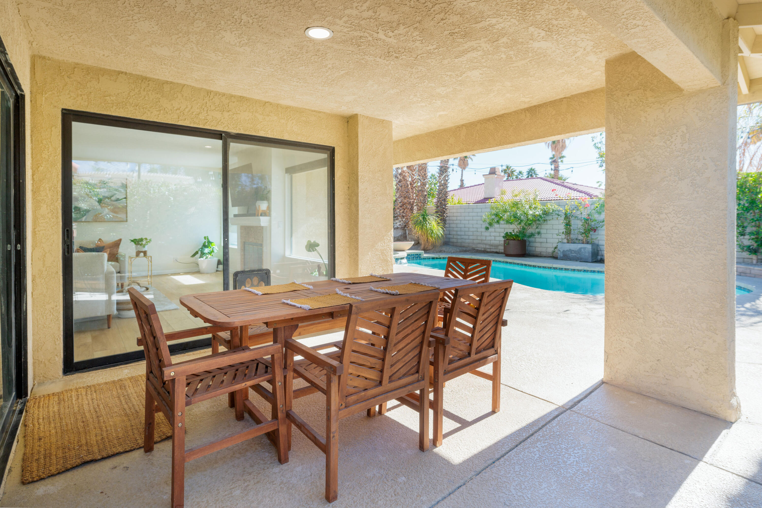 67395 Rango Road Cathedral City, CA 92234 - Photo 24 of 36 a dining room with furniture and a floor to ceiling window