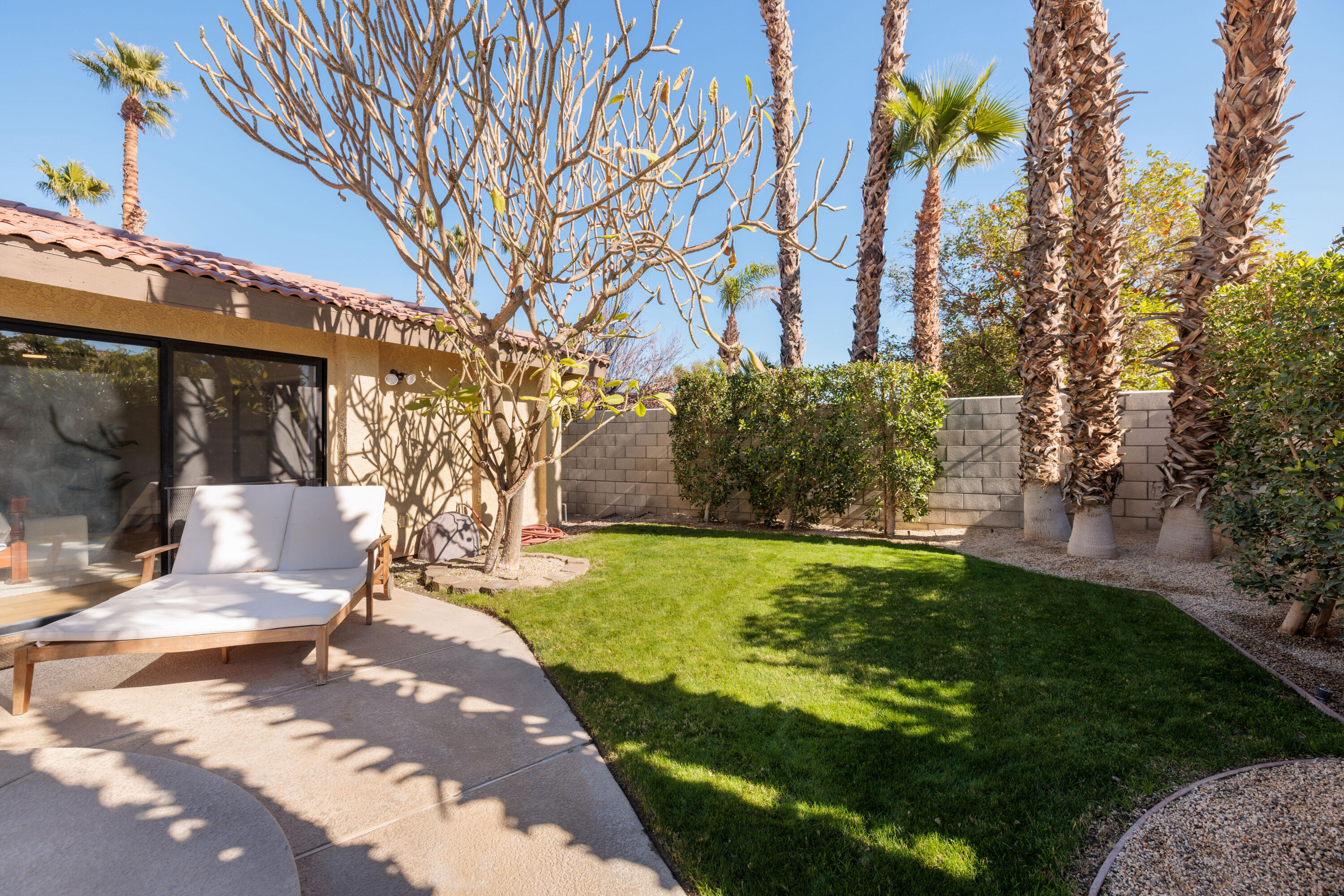 67395 Rango Road Cathedral City, CA 92234 - Photo 30 of 36 a view of a house with a yard