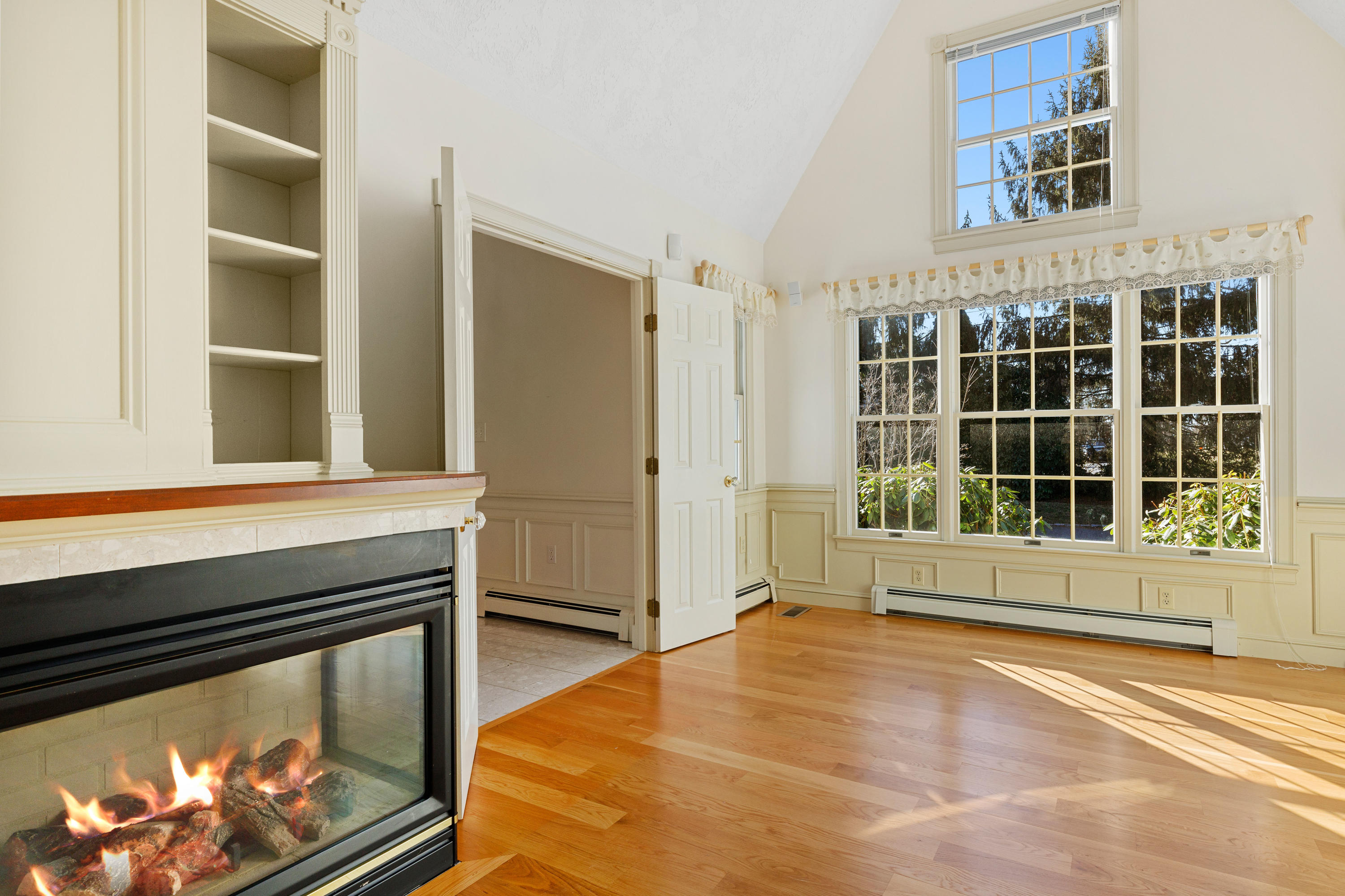 38 Parker Road Osterville, MA 02655 - Photo 11 of 58 a view of an empty room with a window and kitchen view