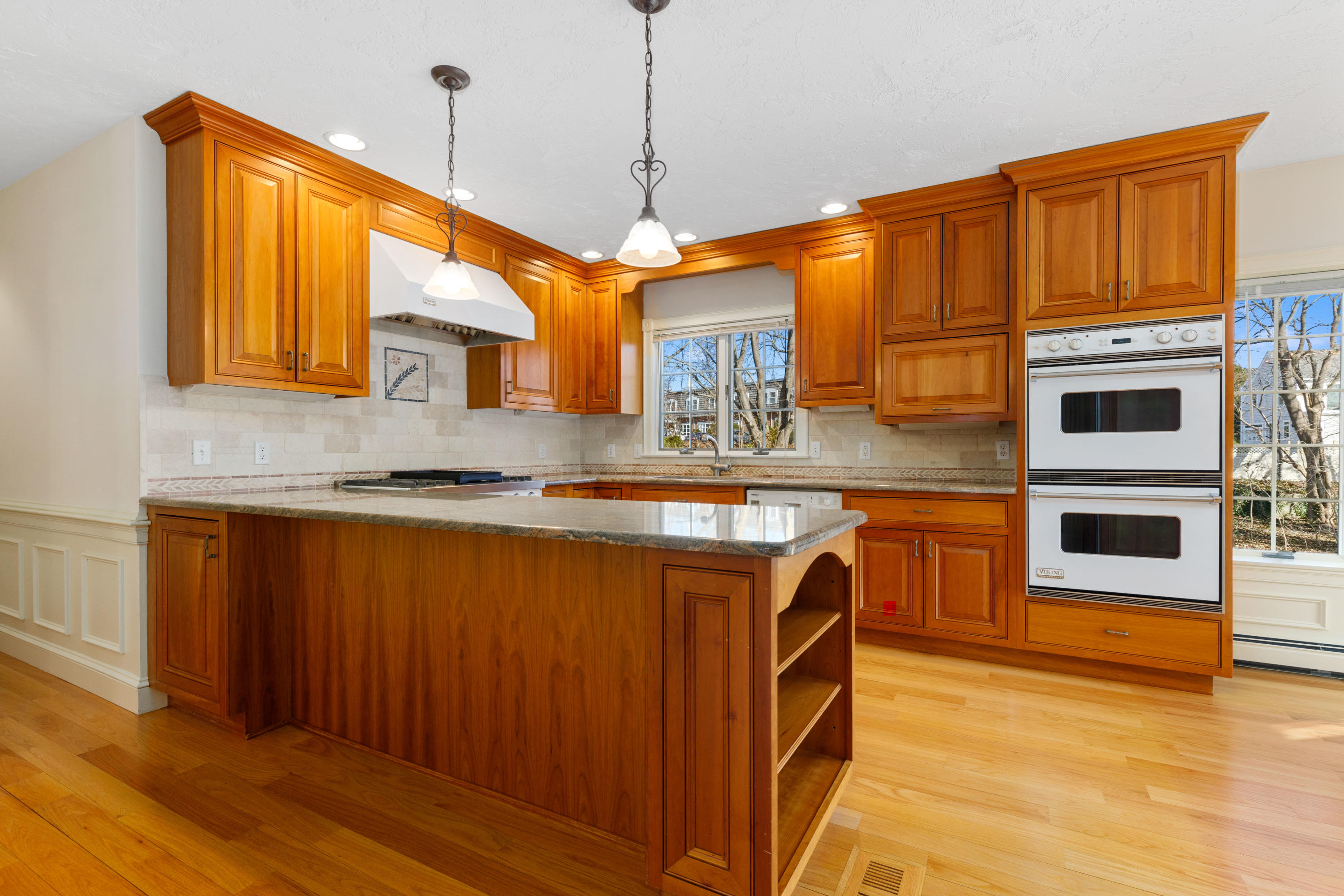 38 Parker Road Osterville, MA 02655 - Photo 12 of 58 a kitchen with stainless steel appliances granite countertop wooden cabinets a sink and dishwasher