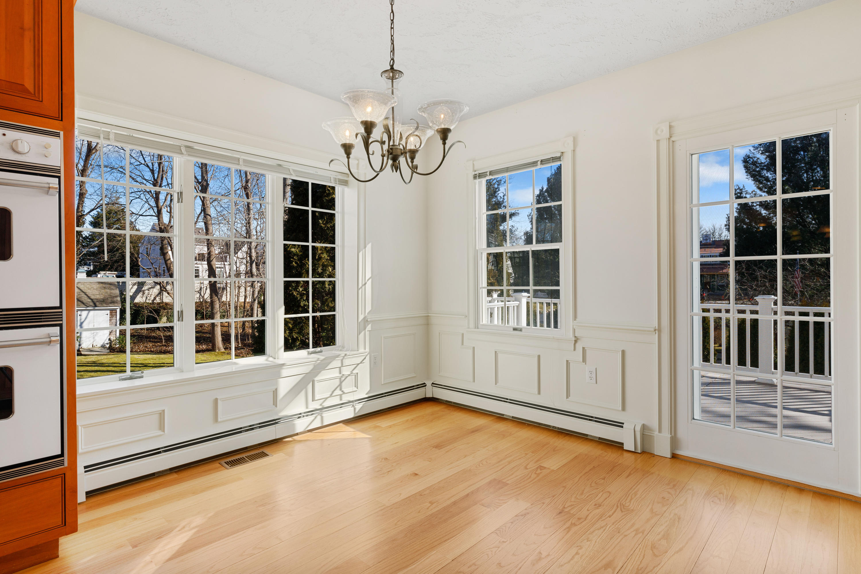 38 Parker Road Osterville, MA 02655 - Photo 15 of 58 a view of an empty room with a window and wooden floor