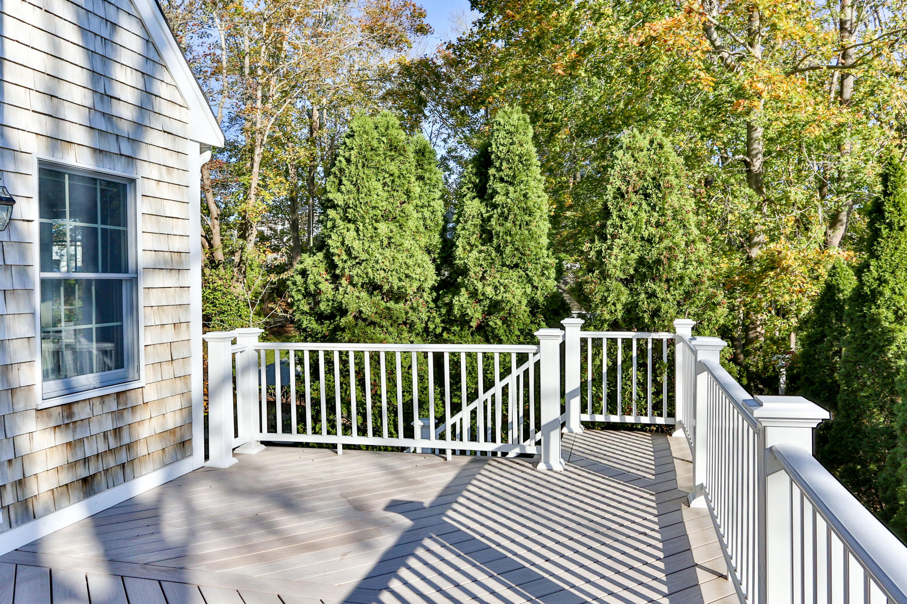 38 Parker Road Osterville, MA 02655 - Photo 16 of 58 a view of a balcony with wooden floor
