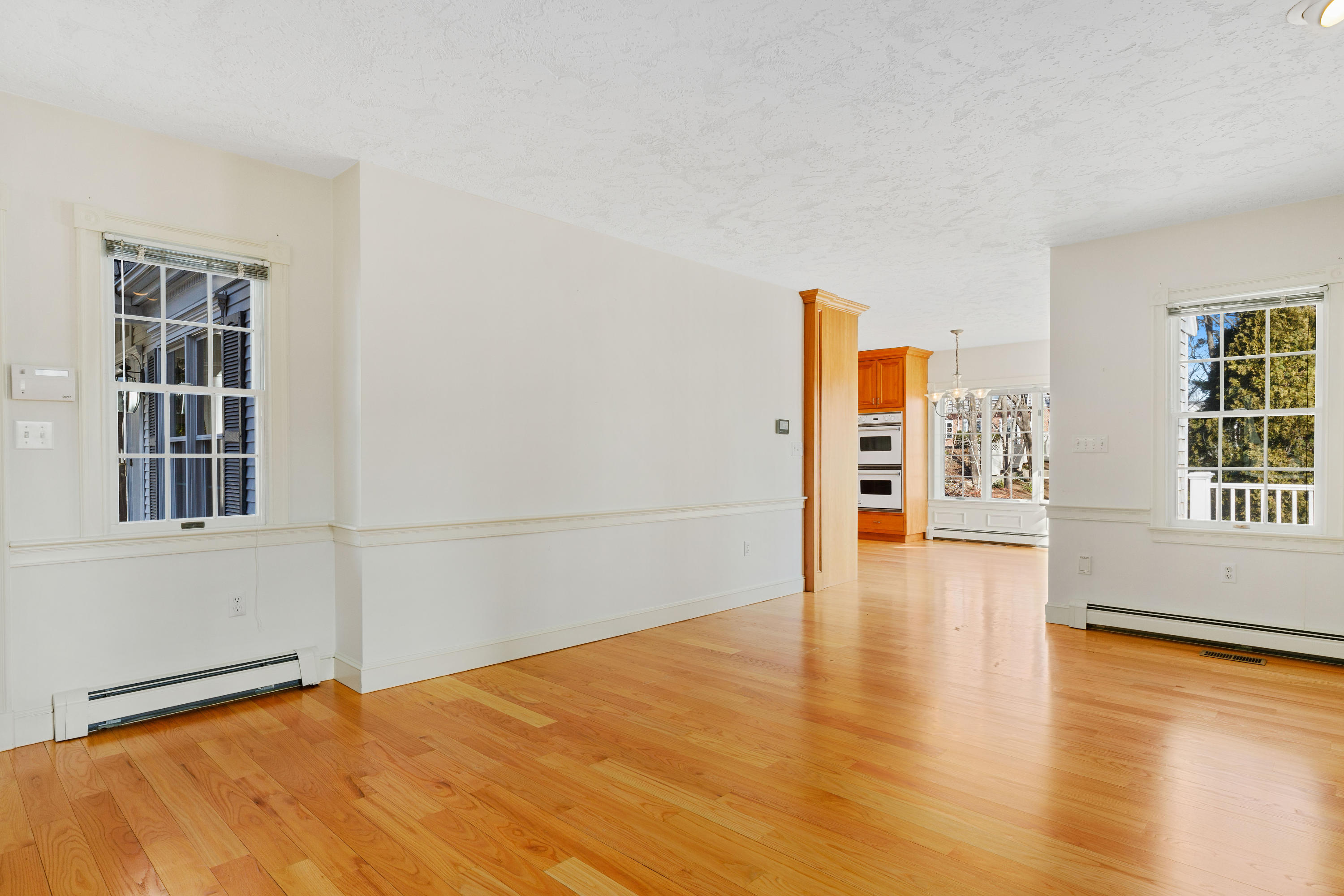 38 Parker Road Osterville, MA 02655 - Photo 22 of 58 a view of an empty room with a window and wooden floor