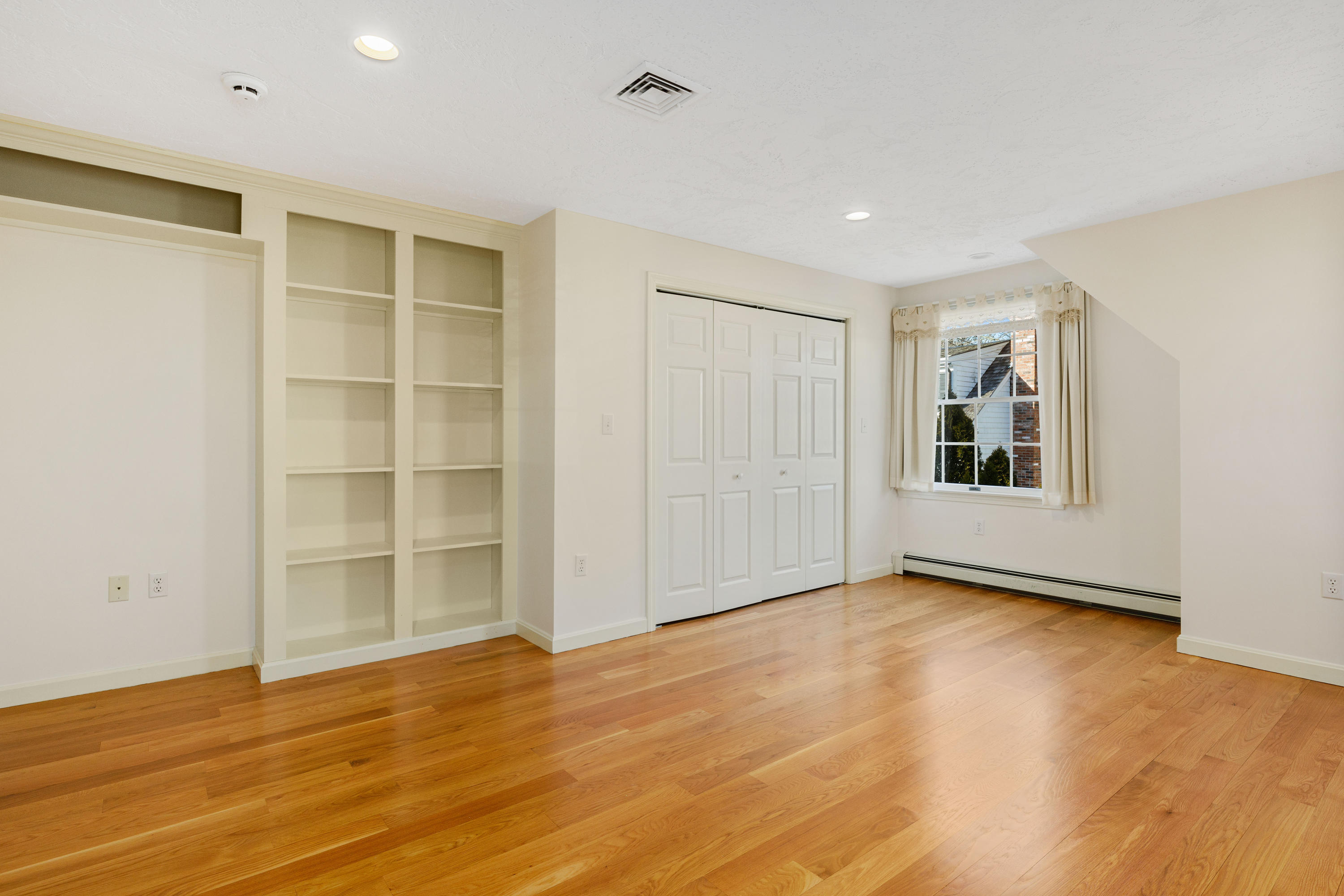 38 Parker Road Osterville, MA 02655 - Photo 27 of 58 a view of an empty room with wooden floor and a window
