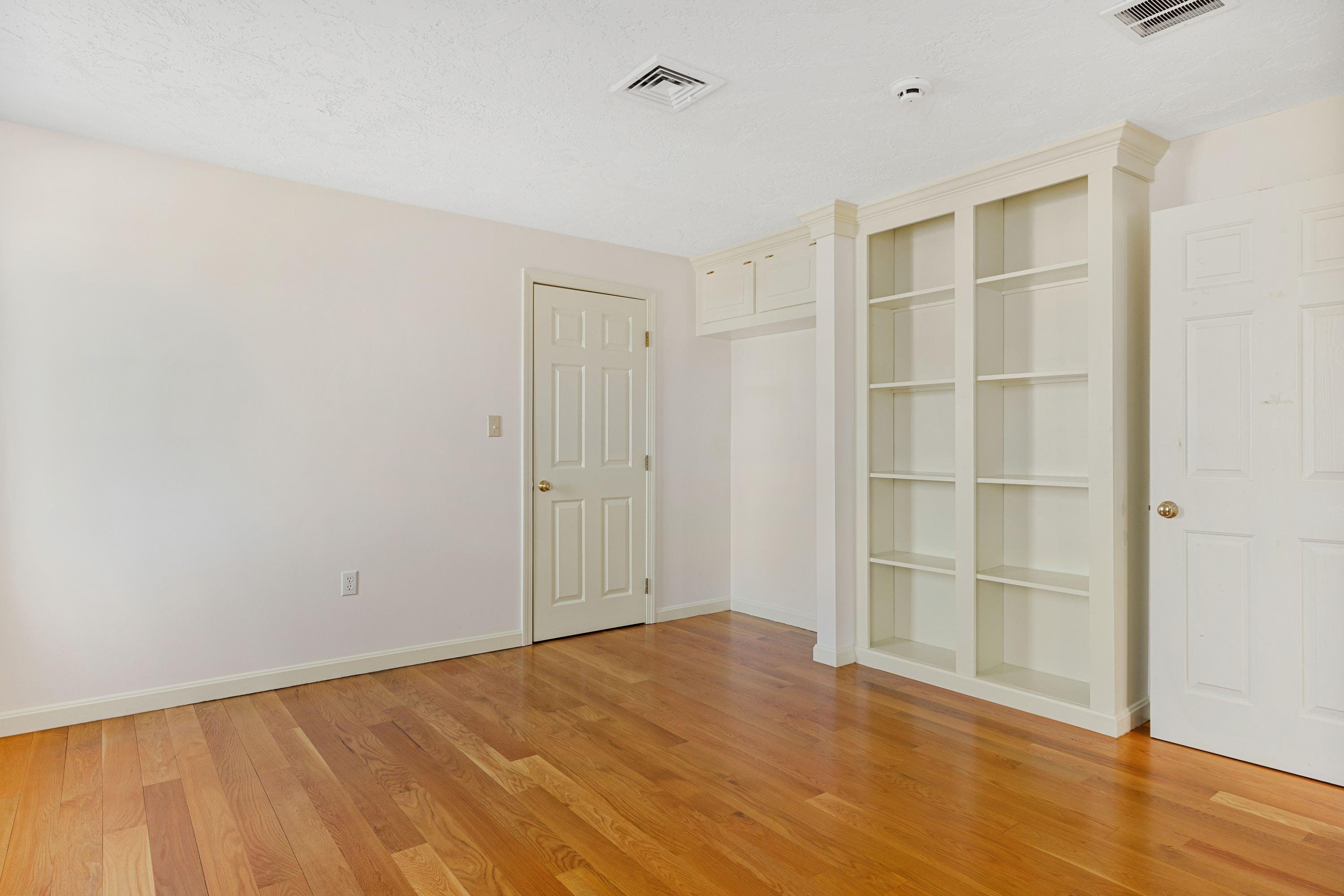 38 Parker Road Osterville, MA 02655 - Photo 31 of 58 a view of an empty room with wooden floor and closet