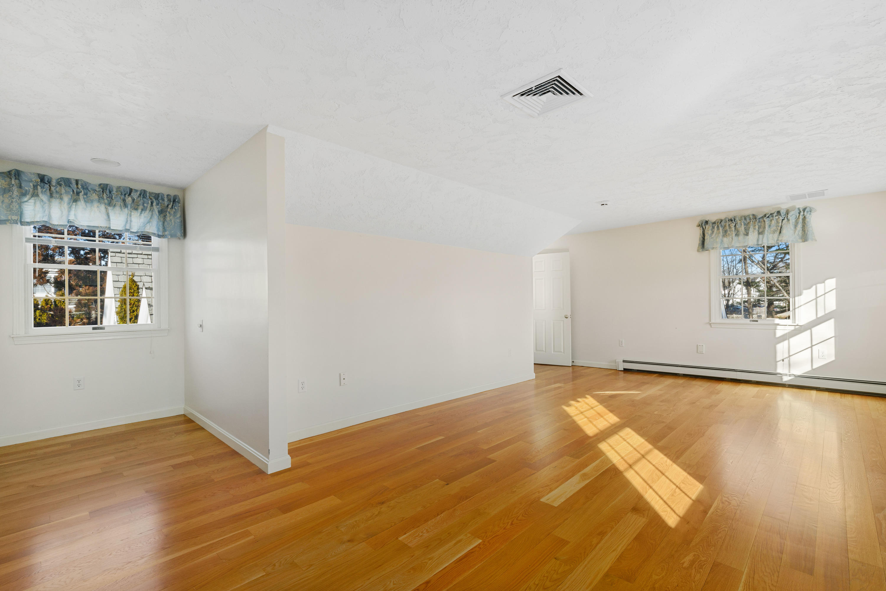 38 Parker Road Osterville, MA 02655 - Photo 35 of 58 a view of an empty room with wooden floor and a window