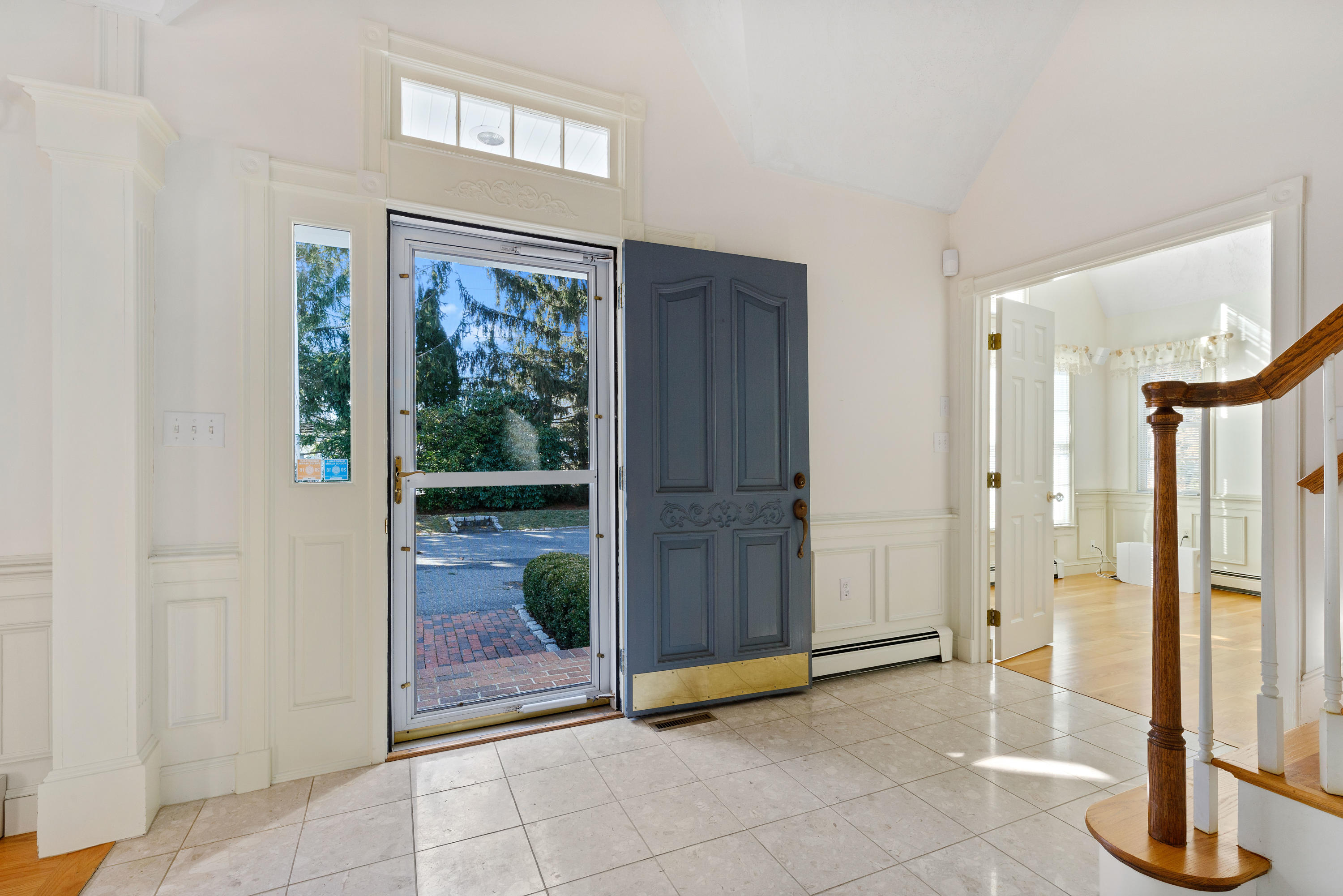 38 Parker Road Osterville, MA 02655 - Photo 4 of 58 a view of an entryway with a floor to ceiling window and wooden floor