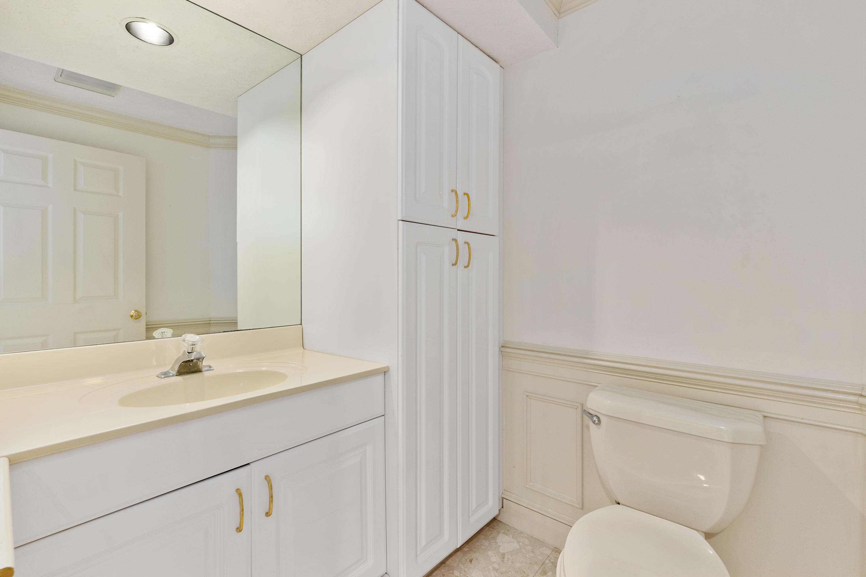 38 Parker Road Osterville, MA 02655 - Photo 46 of 58 a bathroom with a sink a toilet and shower
